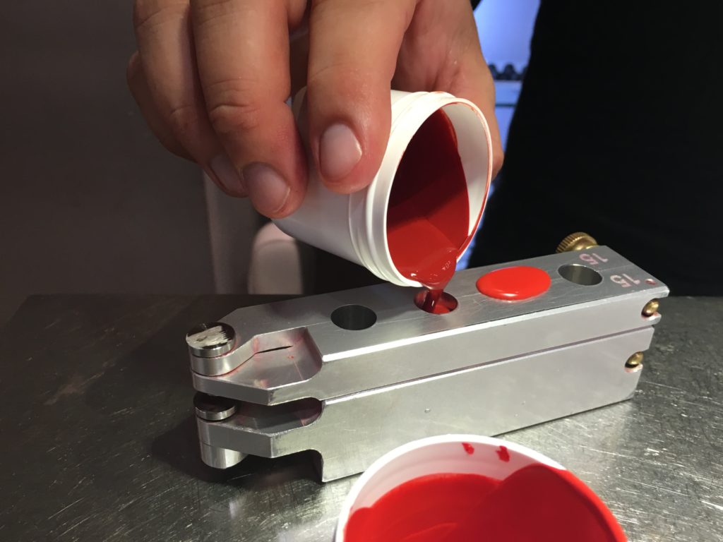 Pouring the color formulation into the mold.