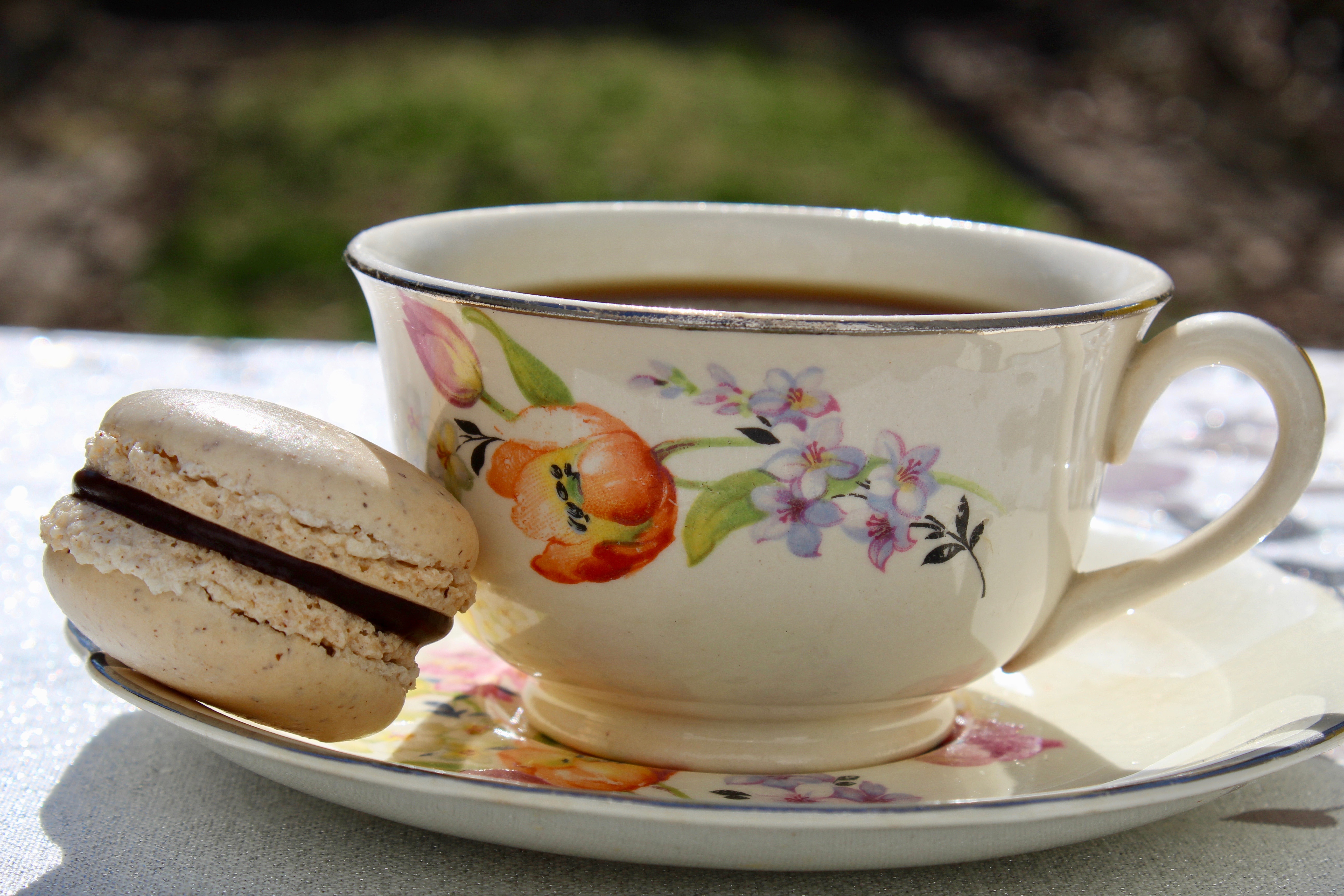 A macaron turns a simple cup of coffee into a special treat!